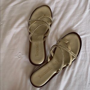Gold flip-flop sandals